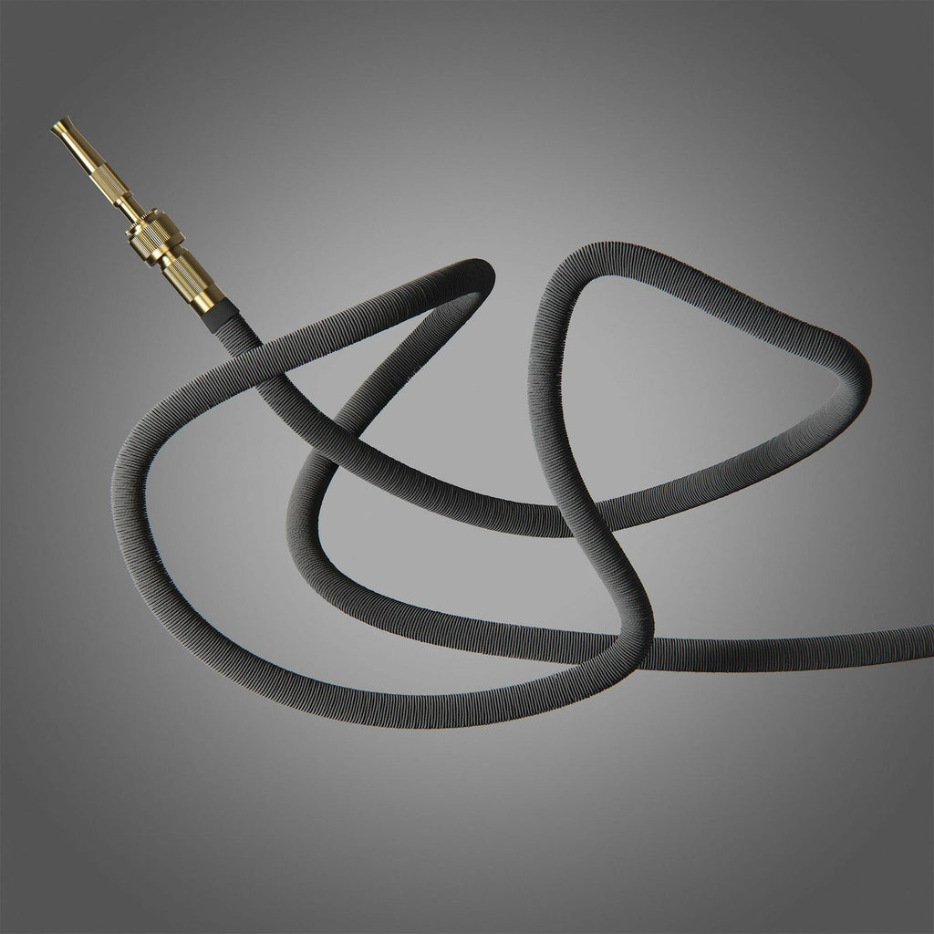 Fritz Tango Soft Expandable Garden Hose in charcoal, artistically coiled against a sleek grey background. Highlighting its durable, kink-free design with premium brass fittings for modern gardening.